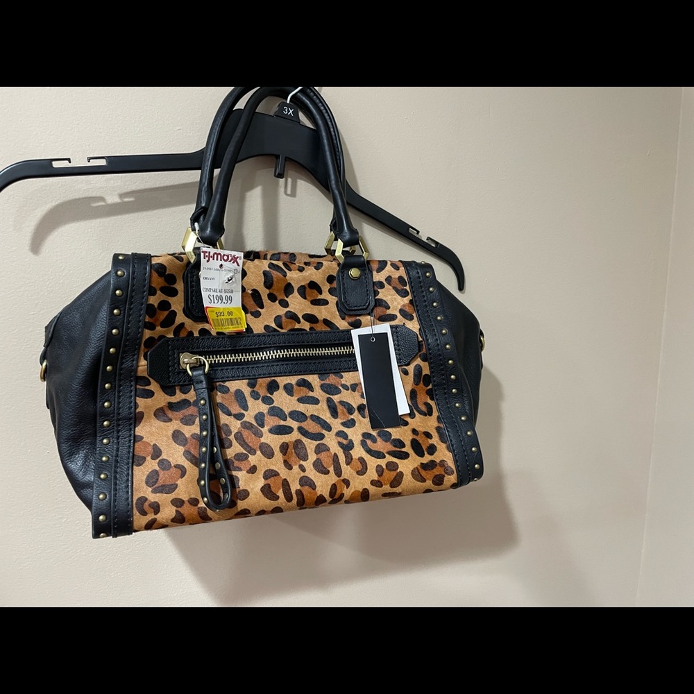 Animal print and leather mid size satchel.